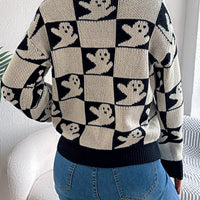 Back view of ghost-pattern checkered round-neck sweater in black and cream.