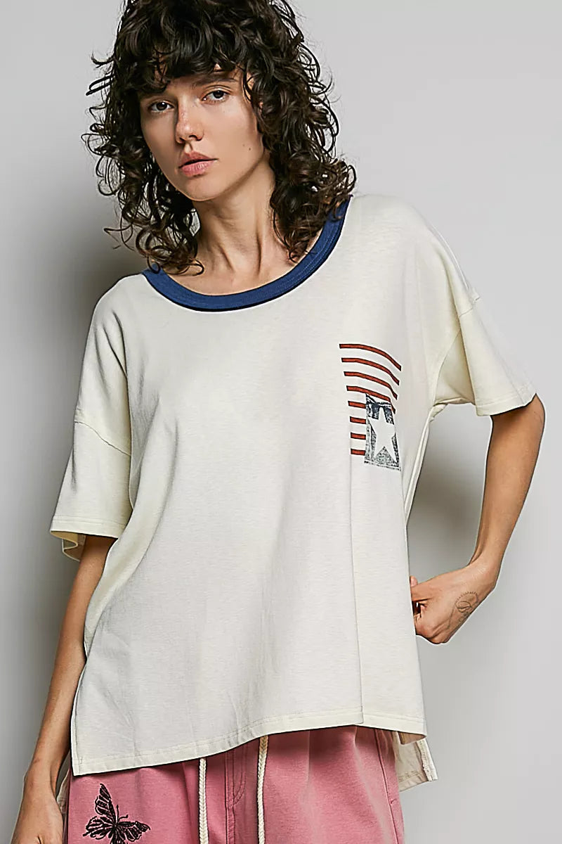 Cream cotton top with blue neckline trim and chest American flag graphic