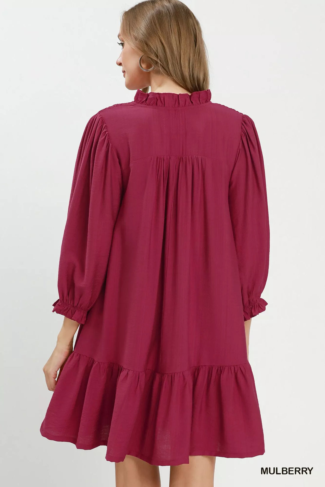 Mulberry mini dress back view with gathered yoke, smocked collar, tiered ruffle hem