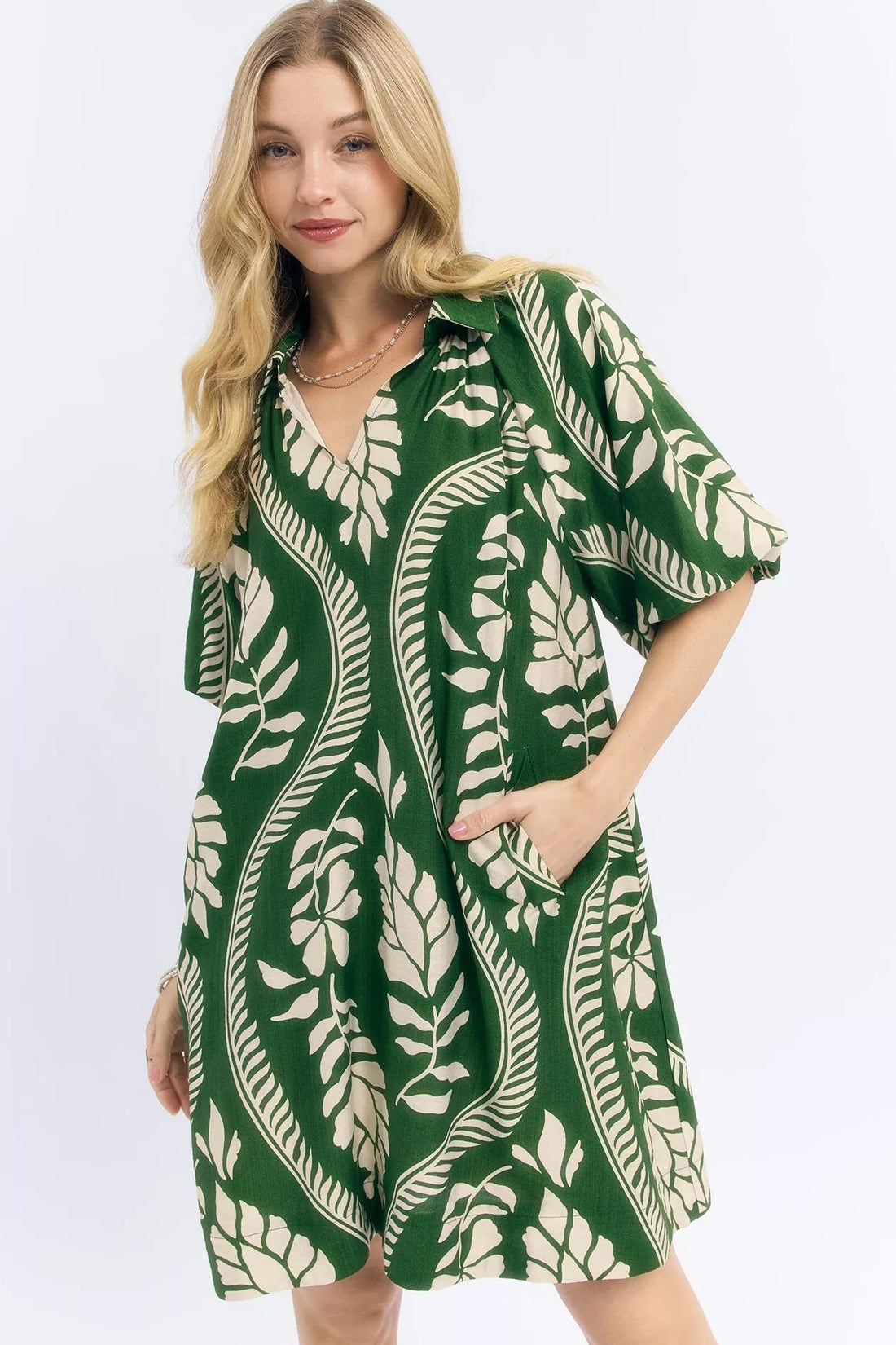 Green and cream leafy print mini dress with V-neck and gathered short sleeves