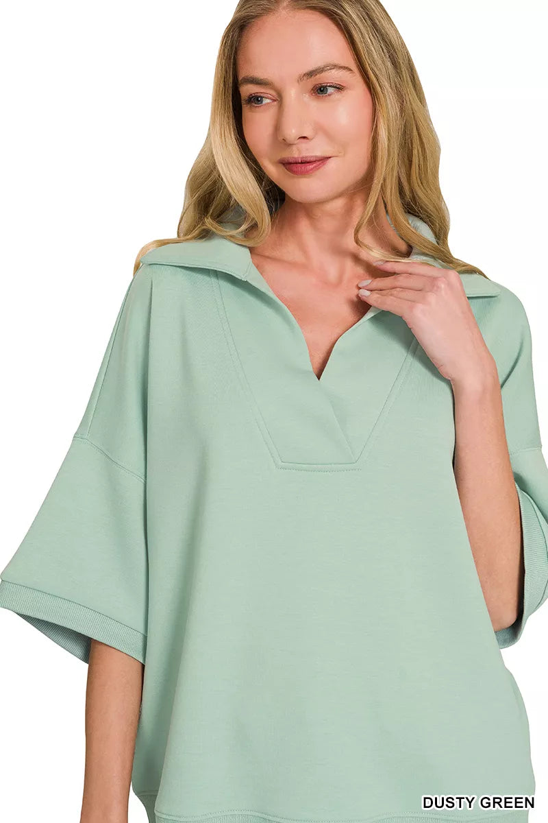 Dusty green collared short-sleeve pullover with V-neck and relaxed fit