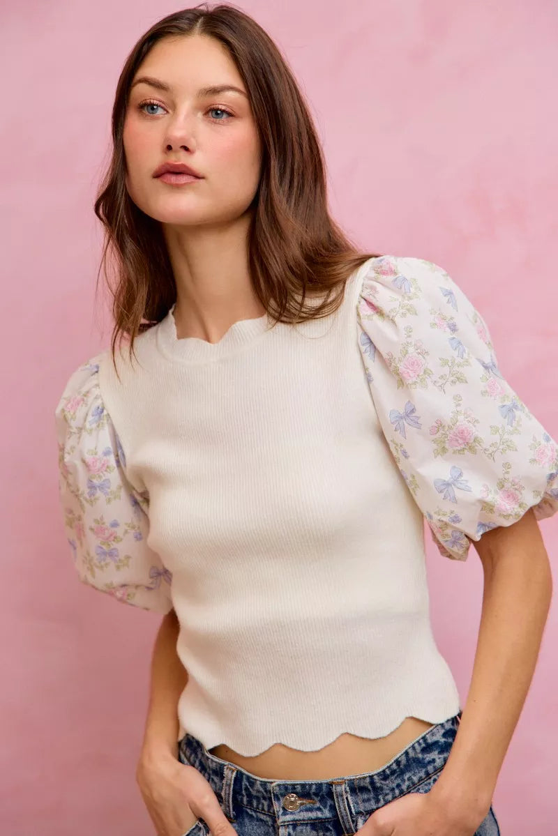 White knit sweater top with puff floral contrast sleeves and scalloped hemline