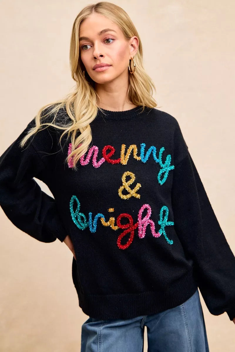 Black Christmas sweater with multicolor sparkle "Merry & Bright" lettering on front