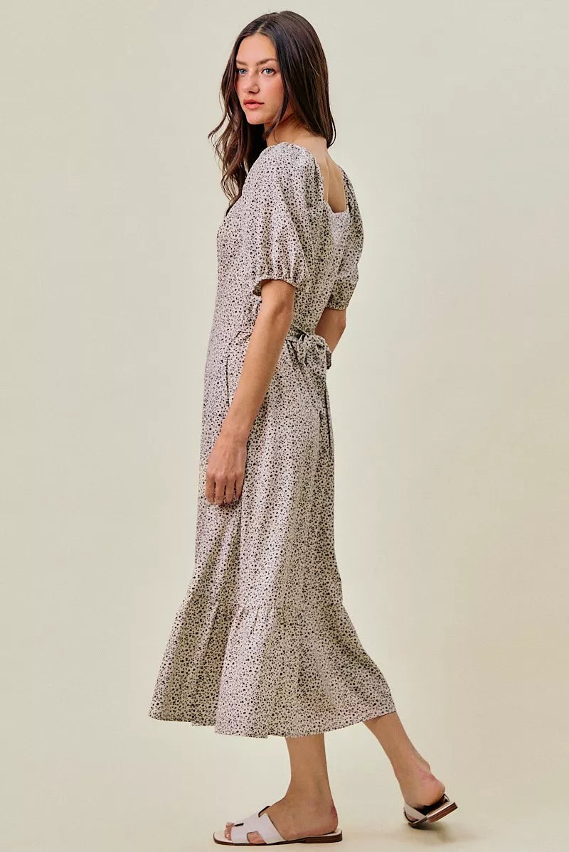 Ditsy floral midi dress in off-white with black speckles, side view, elastic waist belt