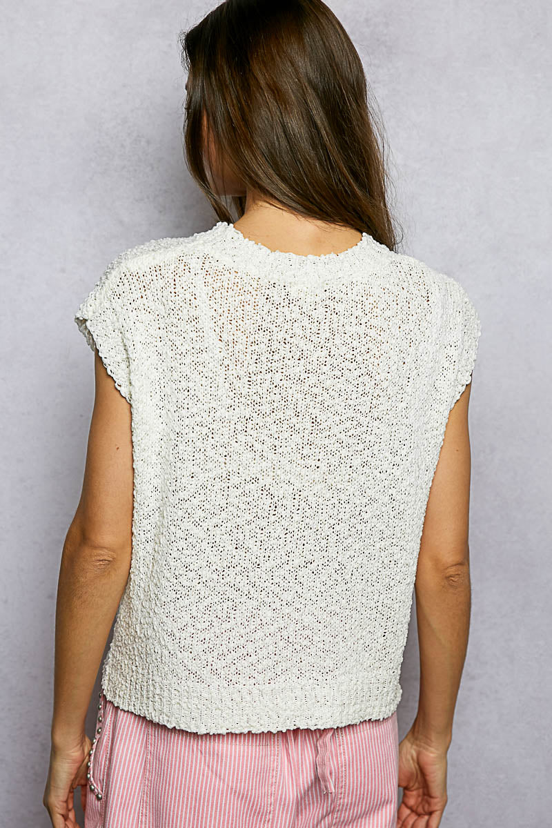 Back view of ivory popcorn knit top with round neck and cap sleeves