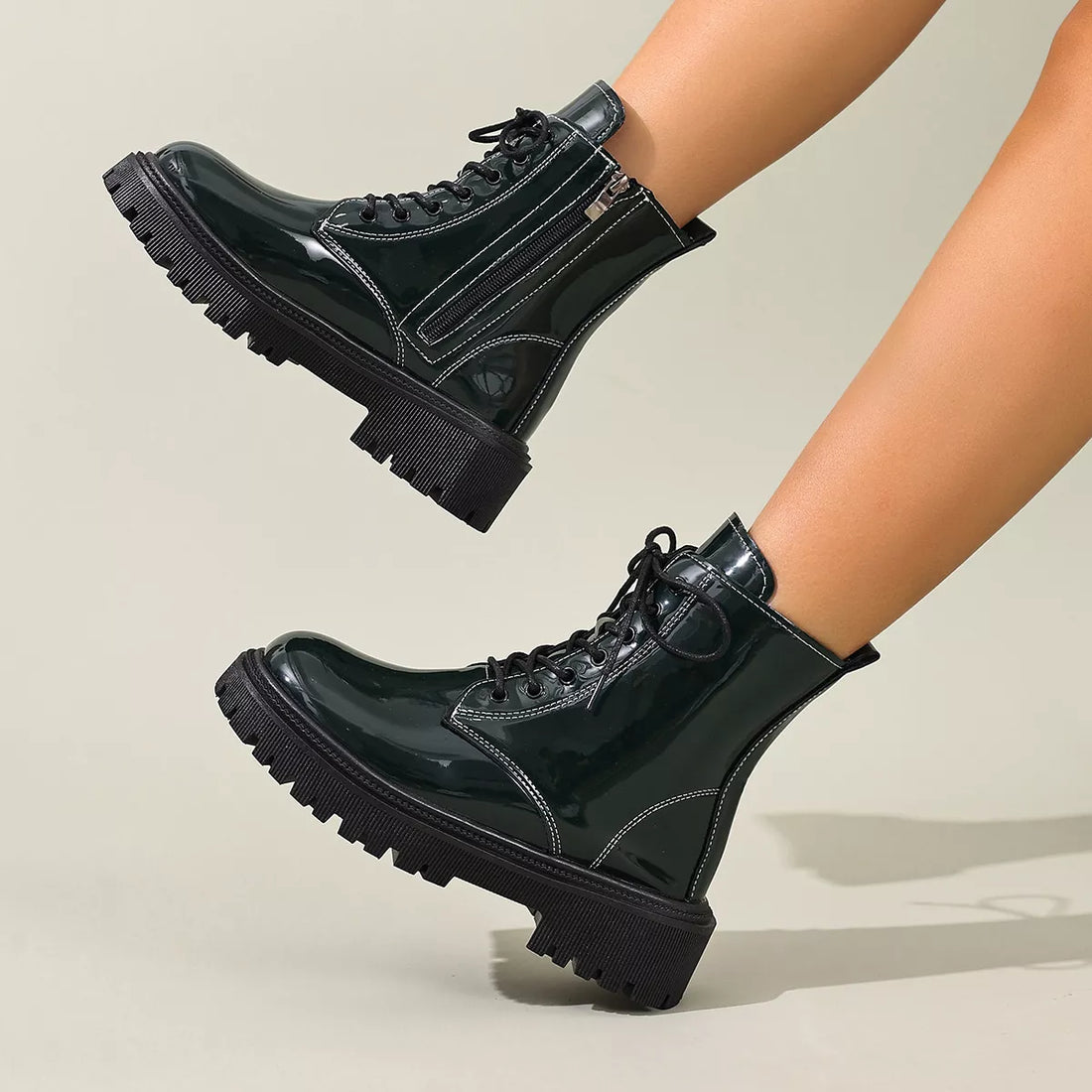 Black patent lace-up block heel boots with side zipper and chunky lug sole