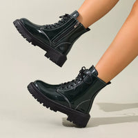 Black patent lace-up block heel boots with side zipper and chunky lug sole