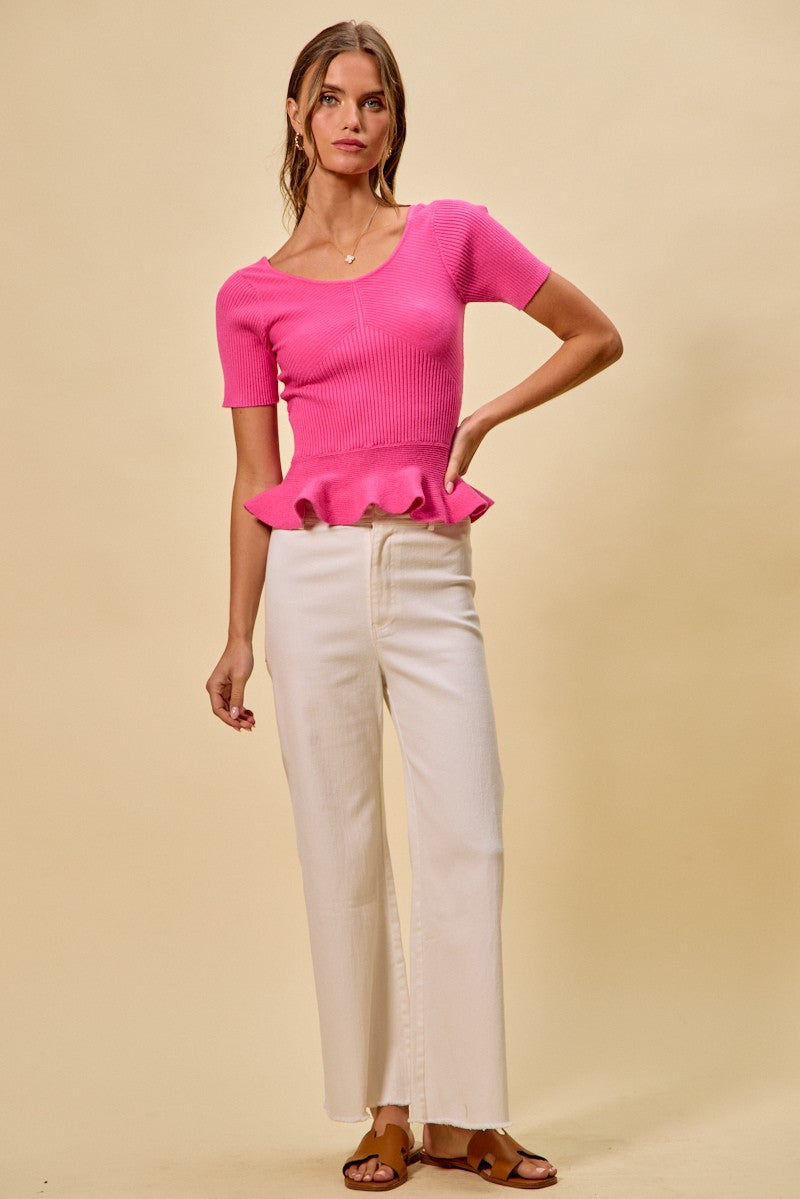 Hot pink ribbed knit peplum sweater top with short sleeves and peplum hem