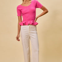 Hot pink ribbed knit peplum sweater top with short sleeves and peplum hem