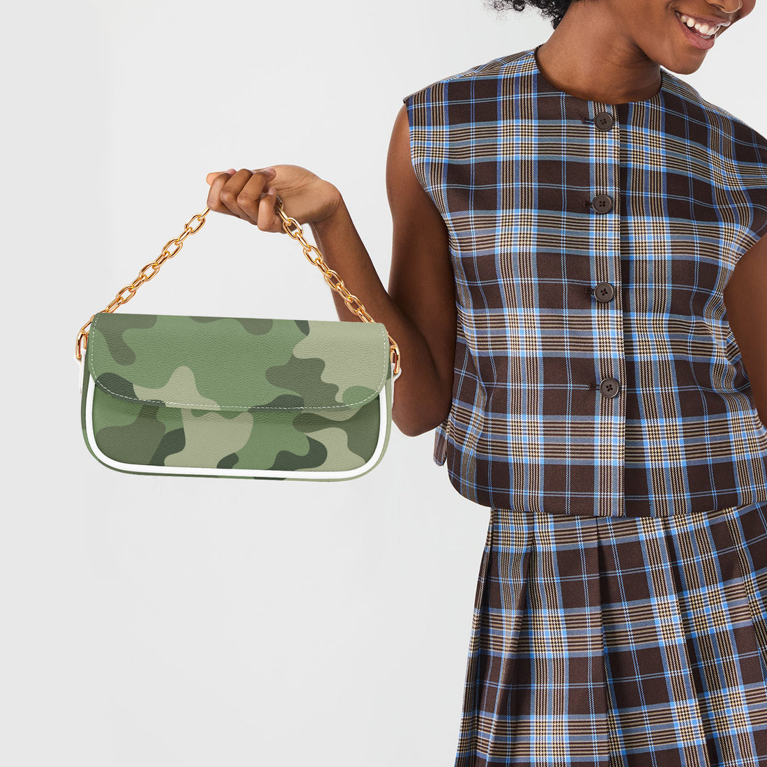 Green camouflage shoulder bag held by white strap, gold chain detail and flap front.