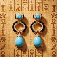 Gold-tone turquoise drop earrings with black enamel hoops and blue teardrops
