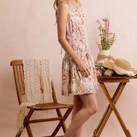 Taupe shell print smocked mini dress, sleeveless side view, fit-and-flare, lined