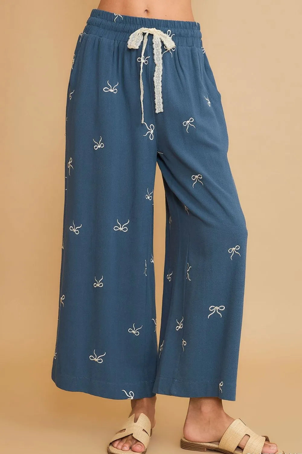 Dusty blue wide-leg drawstring pants with bow embroidery and lace waist tie