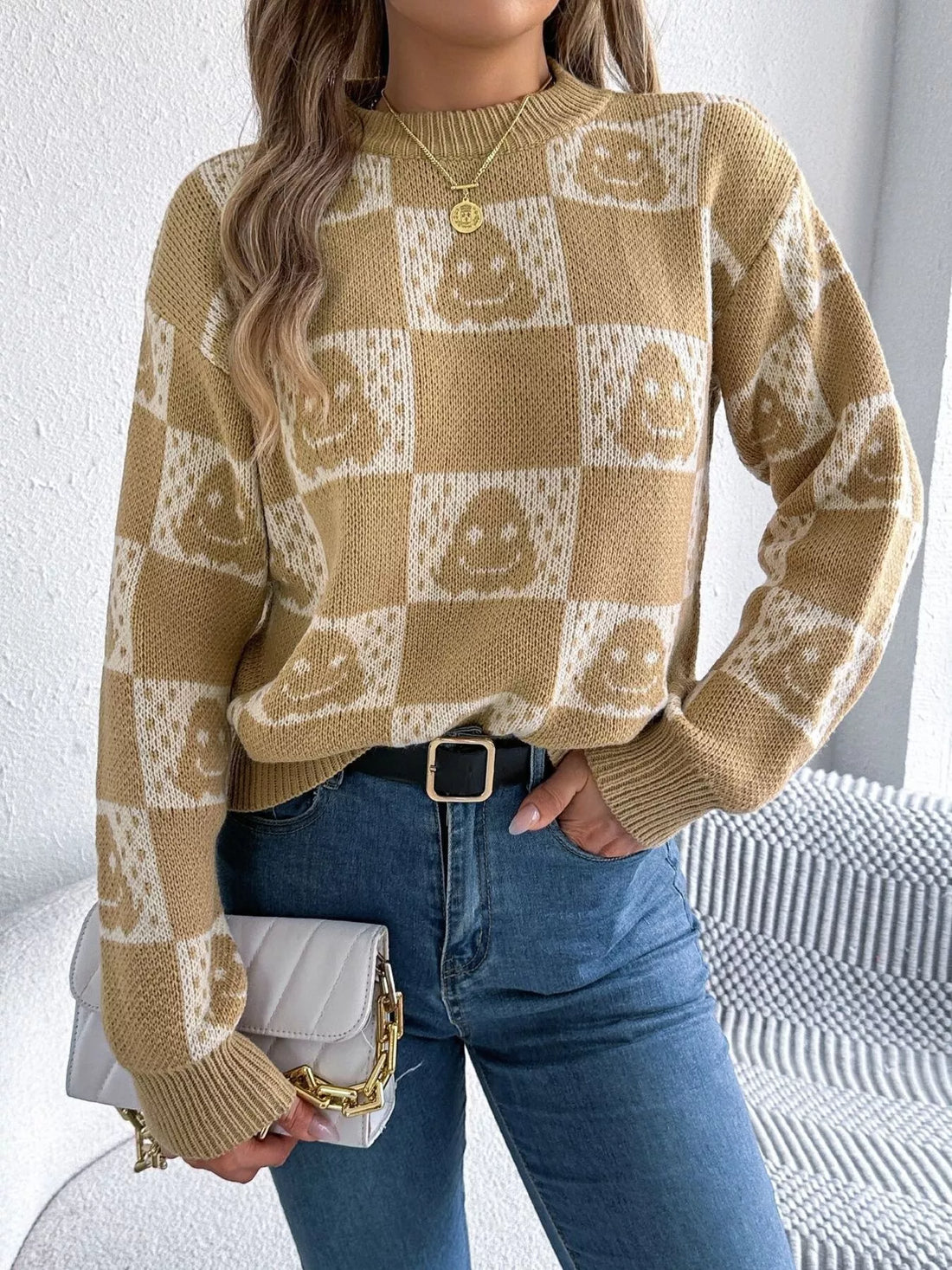 Beige round-neck pullover sweater with checkered ghost pattern, long sleeves