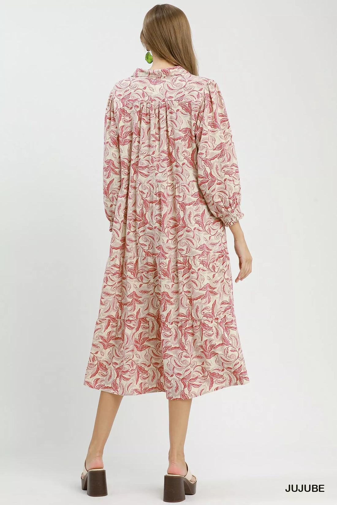 Back view of tiered midi dress with pink botanical print and long sleeves
