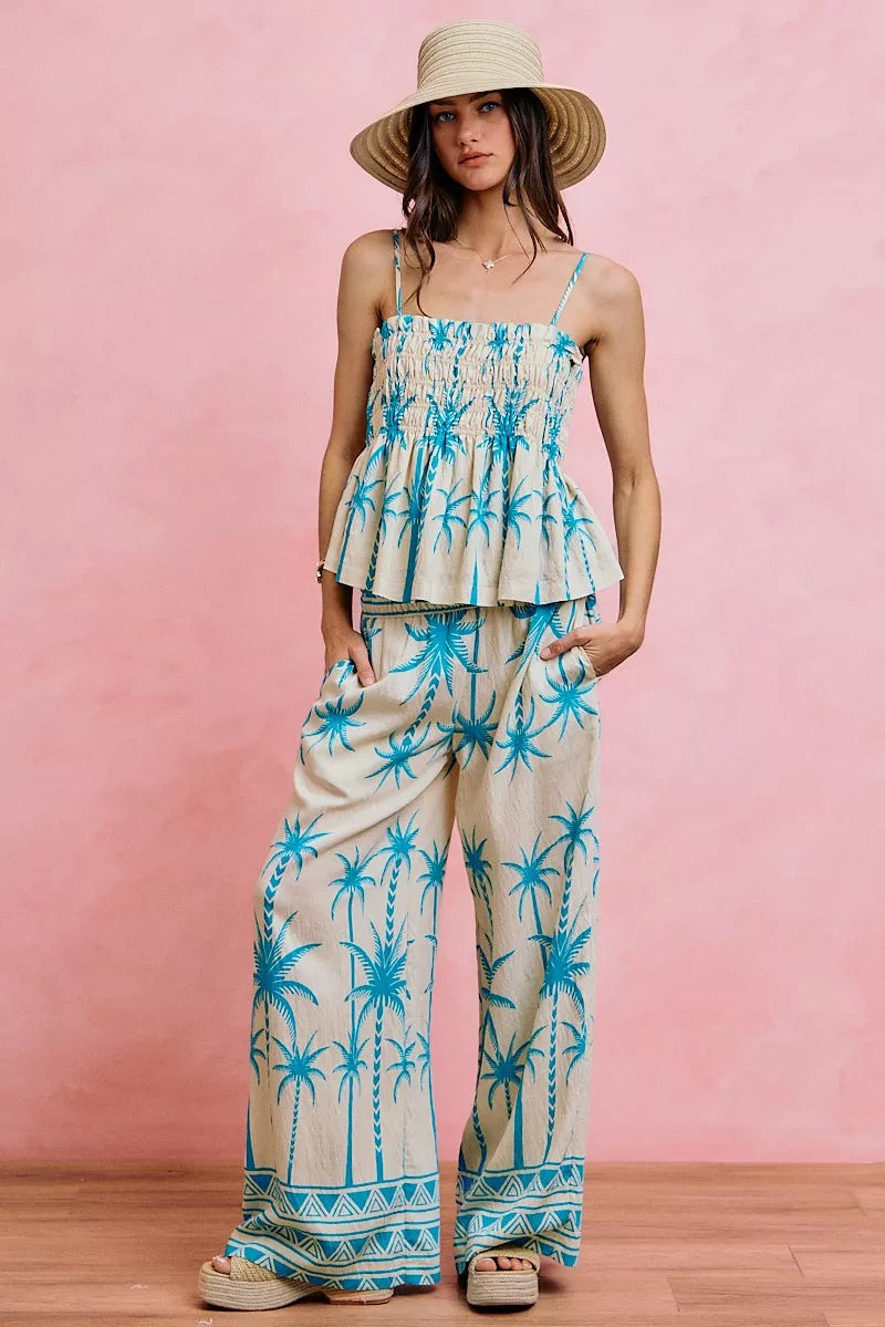 Blue palm-print smocked cami top with adjustable straps and tiered peplum hem