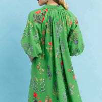 Green floral mini dress, back view with gathered yoke and loose skirt silhouette