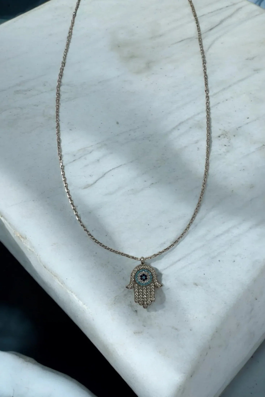 Silver chain necklace with Hamsa hand evil eye pendant, turquoise blue eye