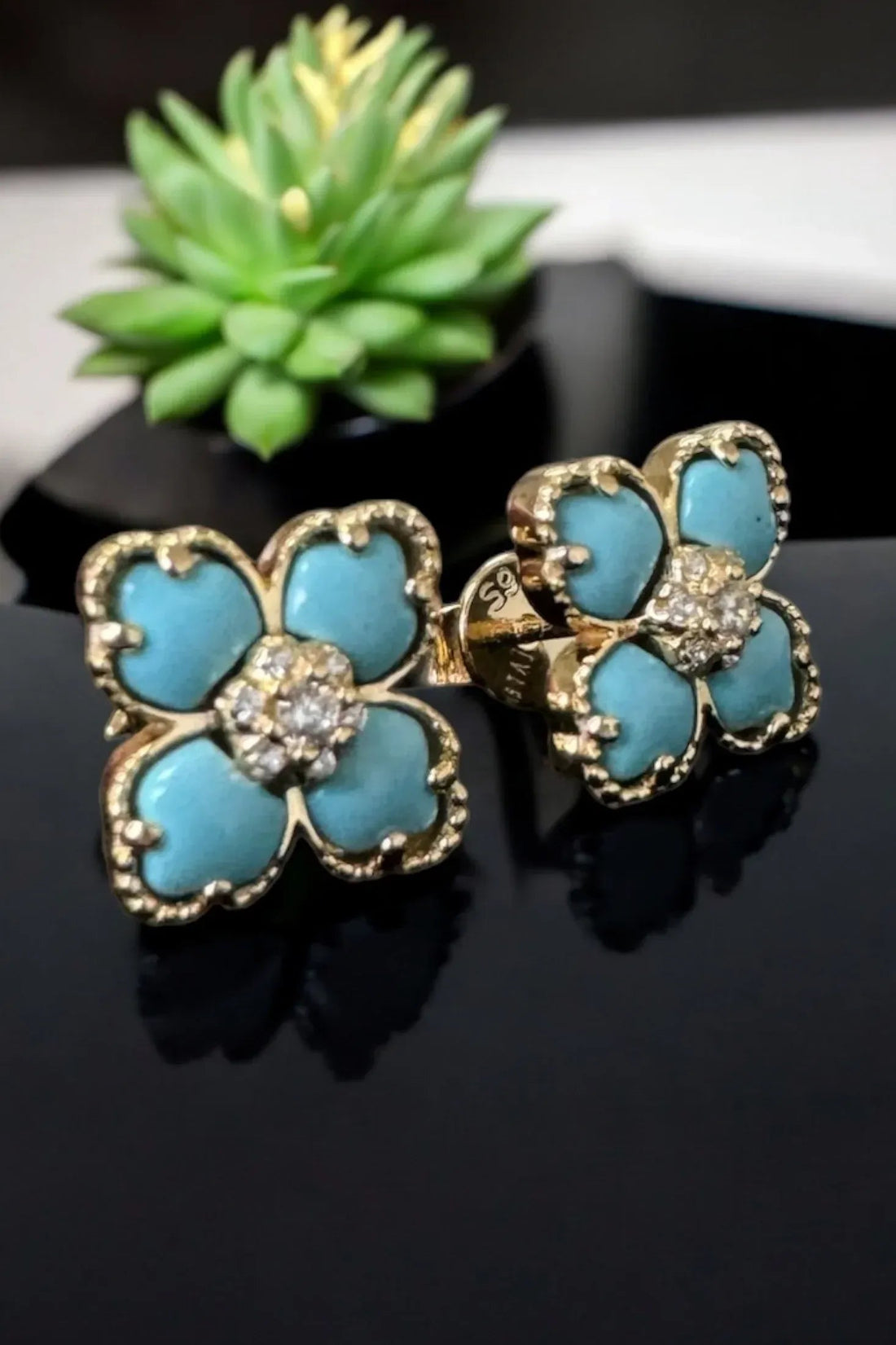 Gold-tone clover turquoise stud earrings with crystal flower center