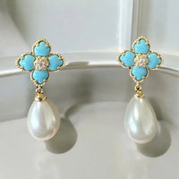 Pair of gold flower clover drop earrings with turquoise enamel and white pearl