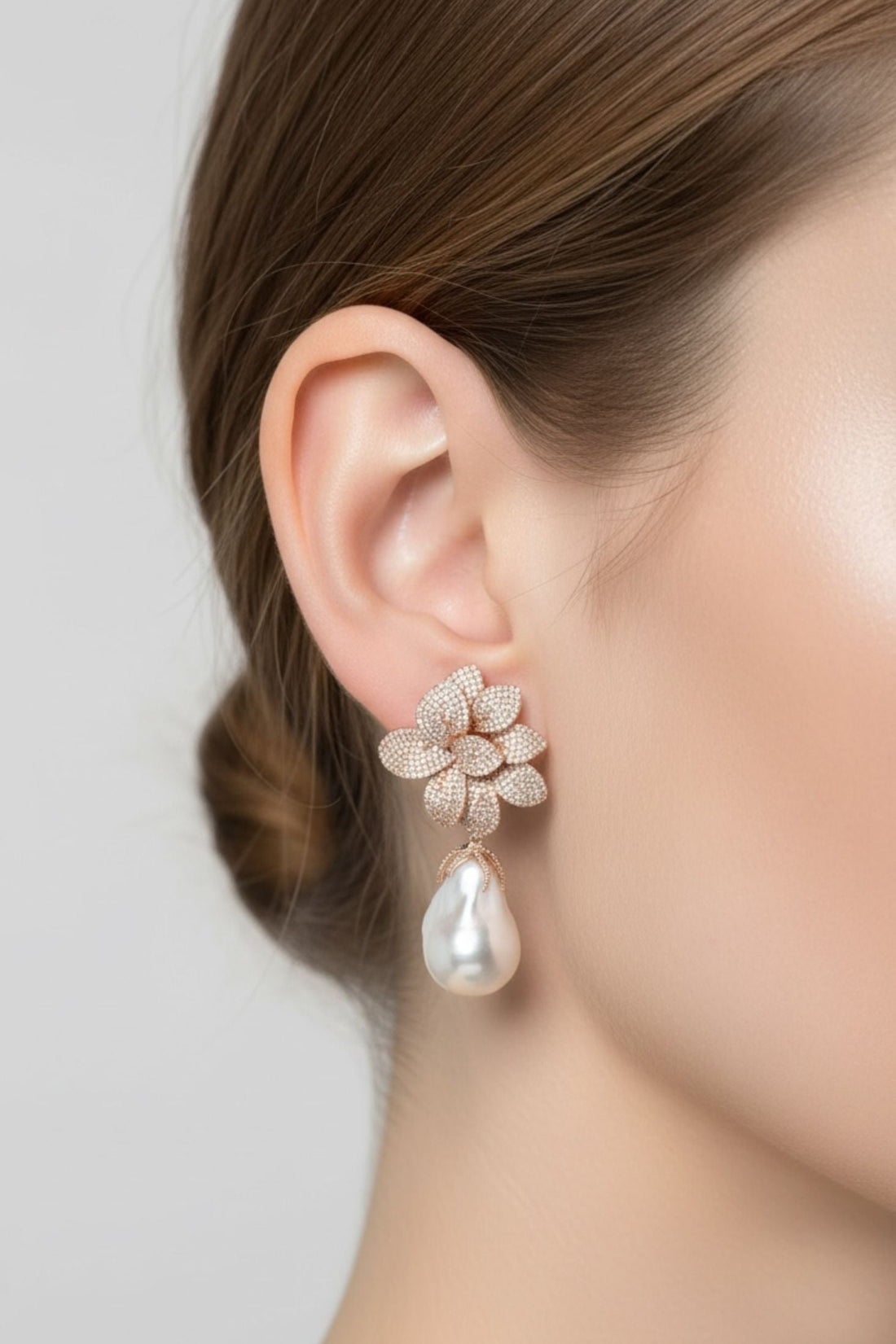 Rose gold flower stud earrings with dangling white pearl drop