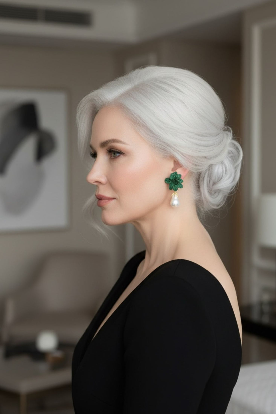 Green flower and baroque pearl drop earrings worn by model
