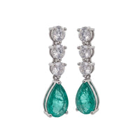 Silver triple drop earrings with teal pear stones and three-tier round crystal clusters