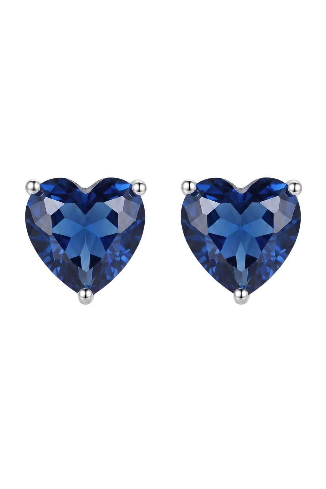 Silver-tone heart-shaped sapphire-blue stud earrings with prong settings