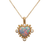 Gold heart pendant necklace with opal-like iridescent center and small round accents