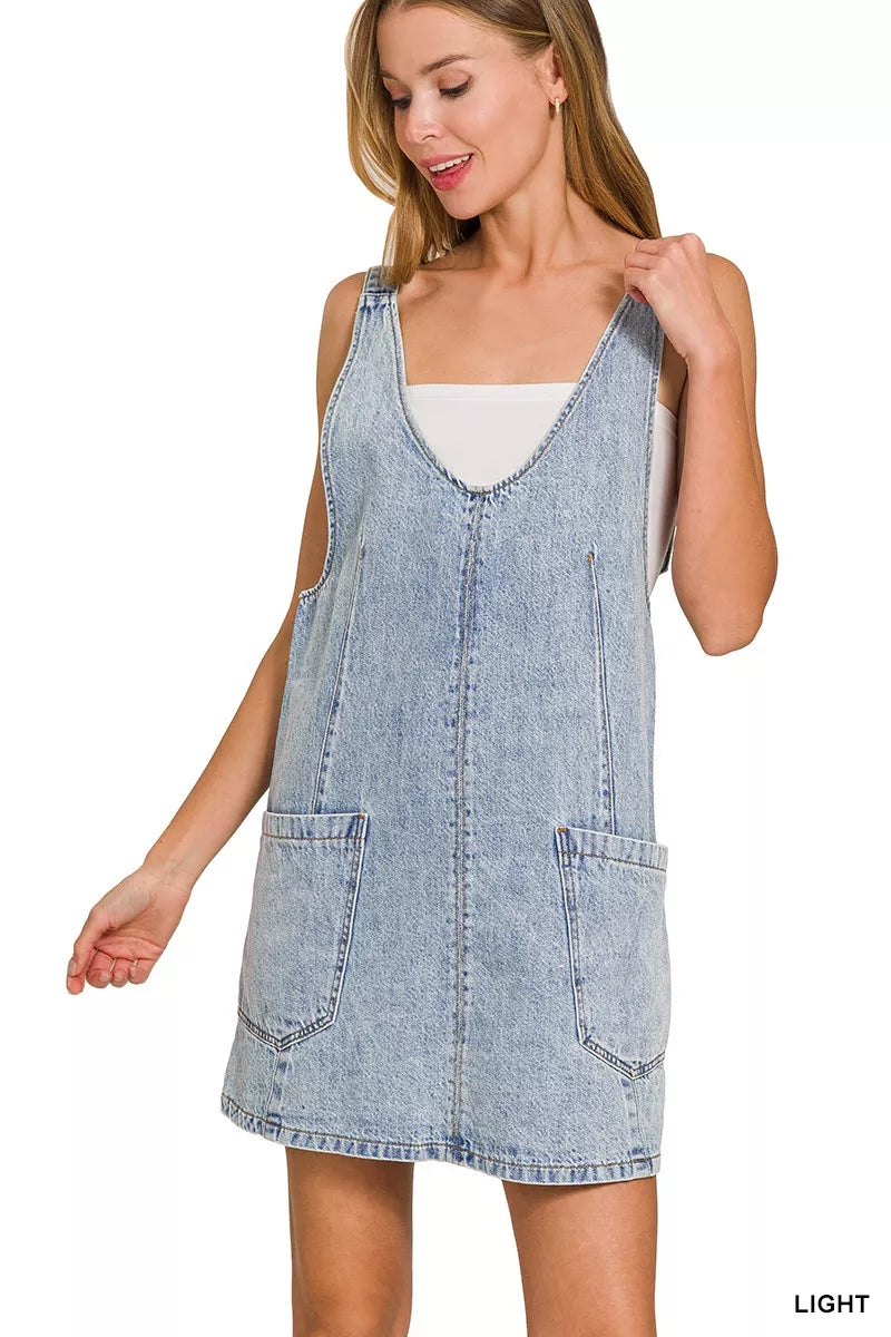 Light wash denim overall dress with square neckline and front pocket detailing