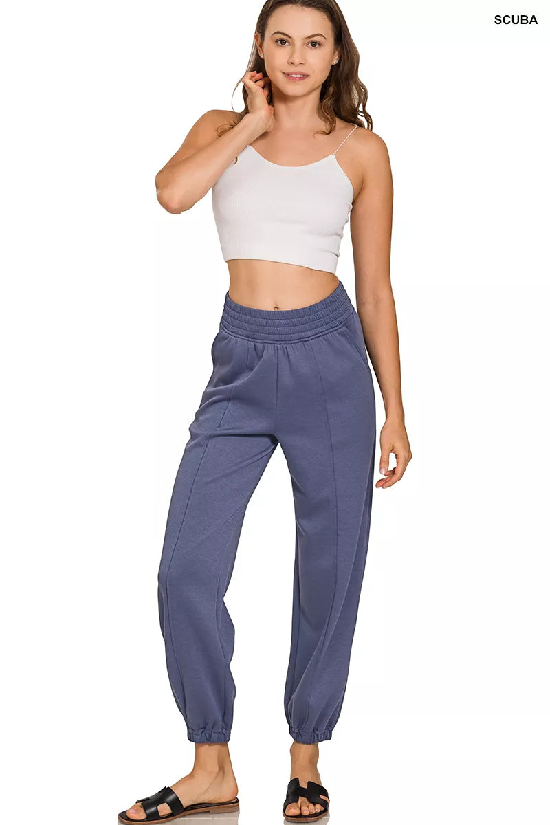 Indigo-blue scuba elastic-waist joggers with pockets and relaxed tapered legs