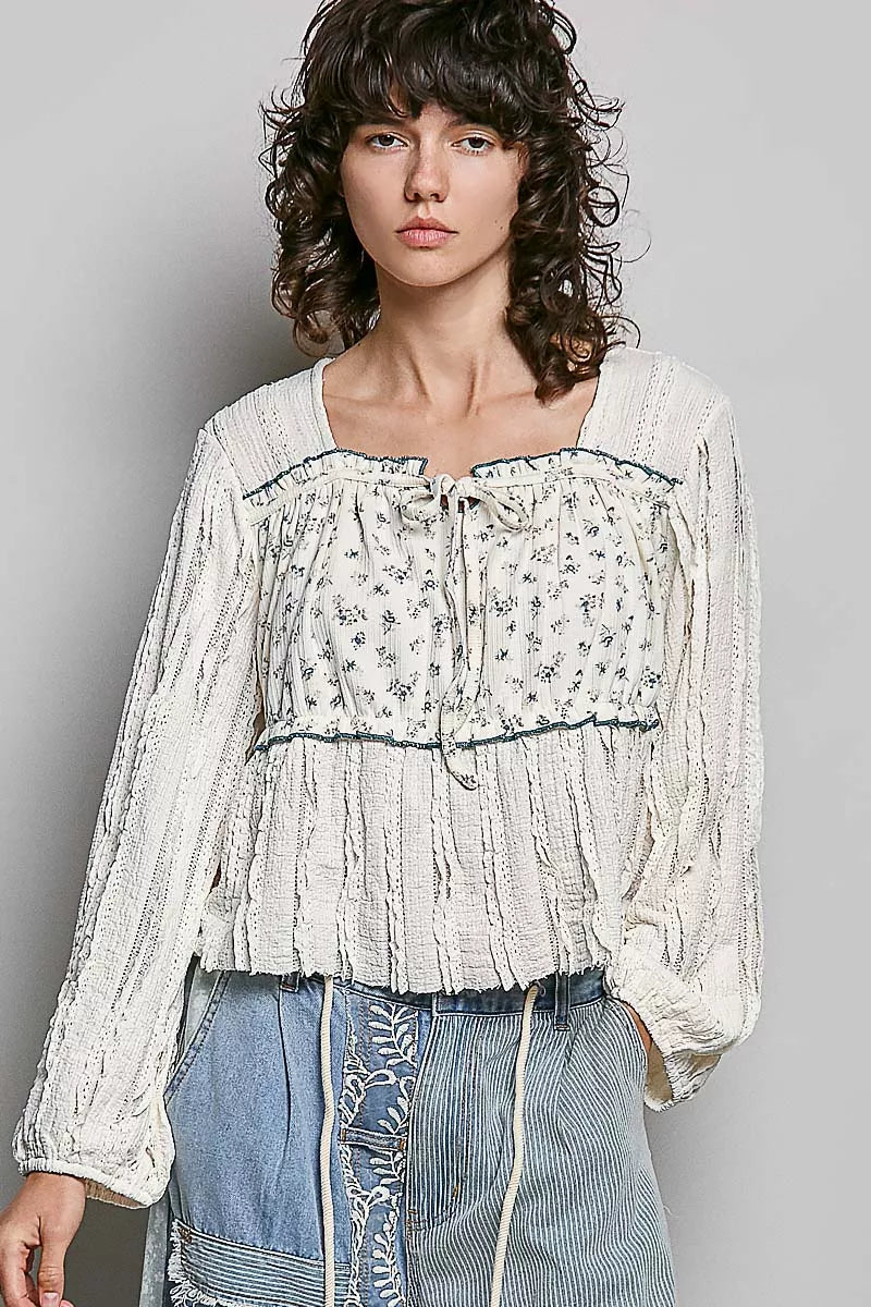 Cream lace long sleeve square-neck top with gathered bodice and blue-trim edge