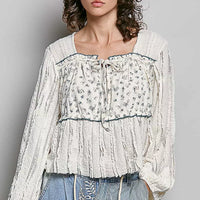 Cream lace long sleeve square-neck top with gathered bodice and blue-trim edge