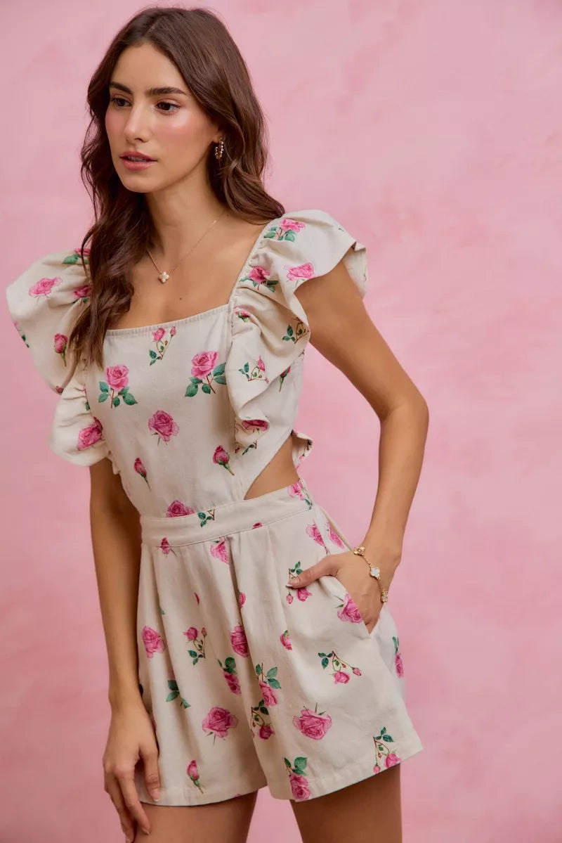 Ivory floral romper with ruffled cap sleeves and cut-out waist, pink and green rose print