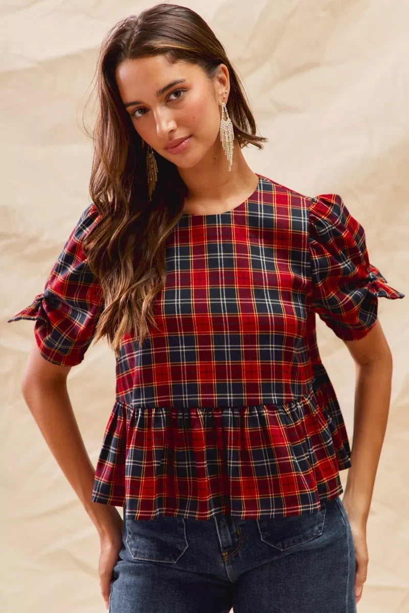 Red plaid peplum top with ribbon-tied short puff sleeves