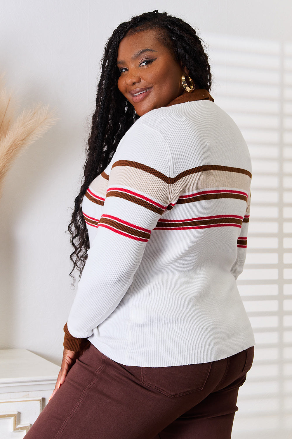 White striped rib-knit top with collared neckline and striped sleeve bands, back view