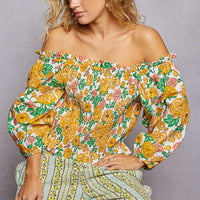 Floral off-shoulder smocked blouse with gathered neckline and long balloon sleeves
