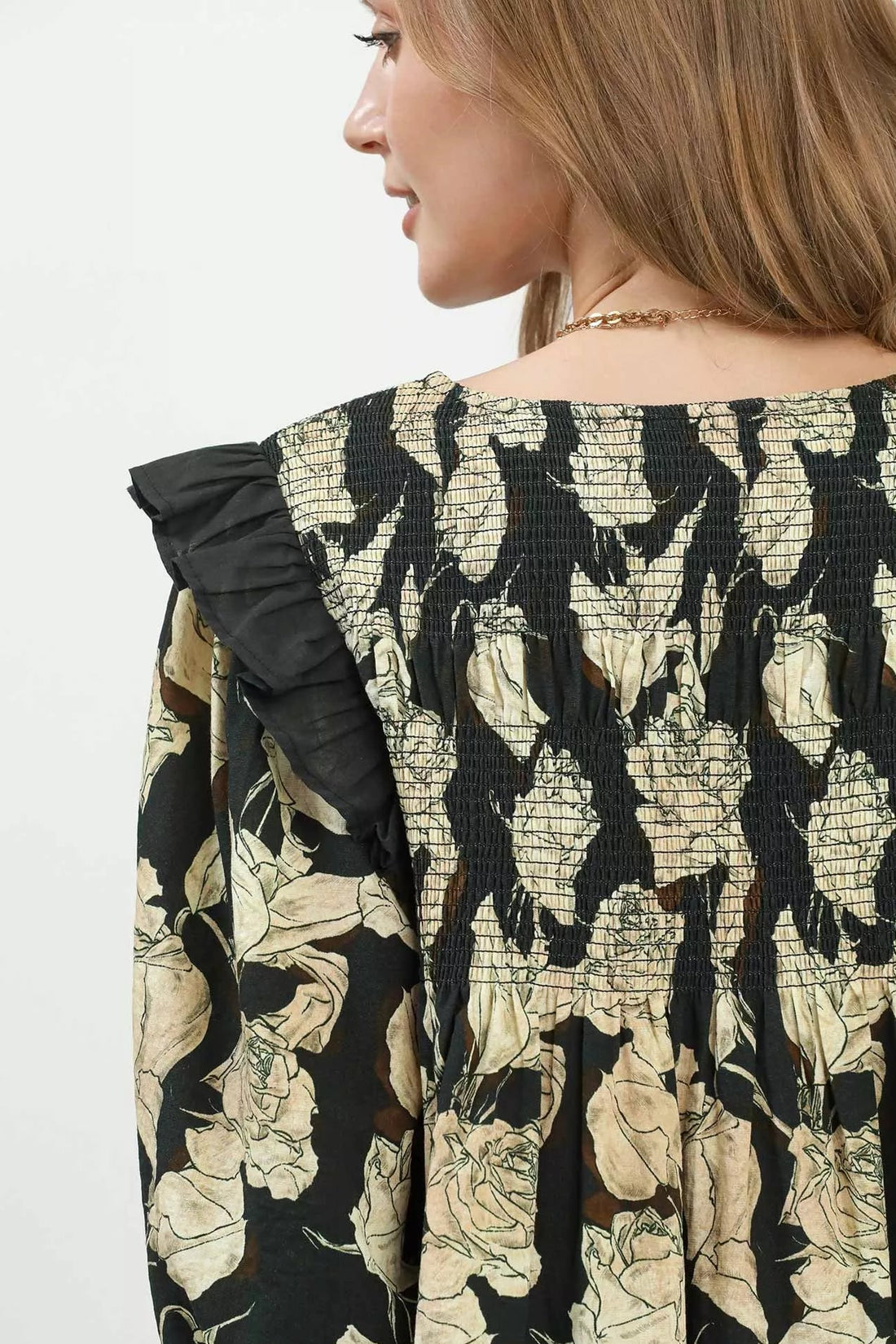 Black-and-cream floral smocked yoke with gathered ruffle sleeve detail