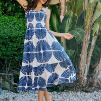 Smocked bodice tiered midi dress with navy abstract print, sleeveless, flared tiers