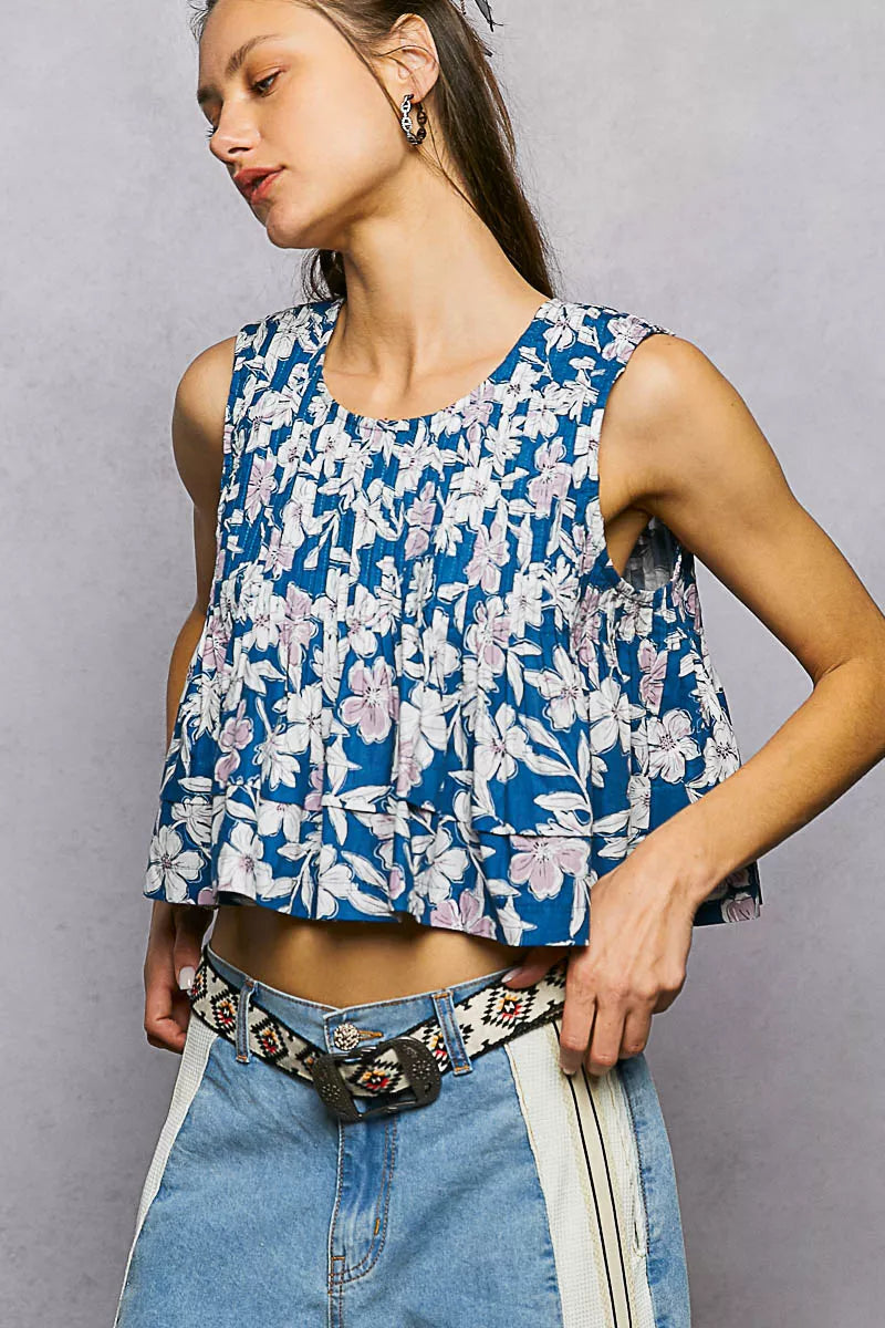 Navy floral sleeveless cropped tank with round neckline and pintuck pleats