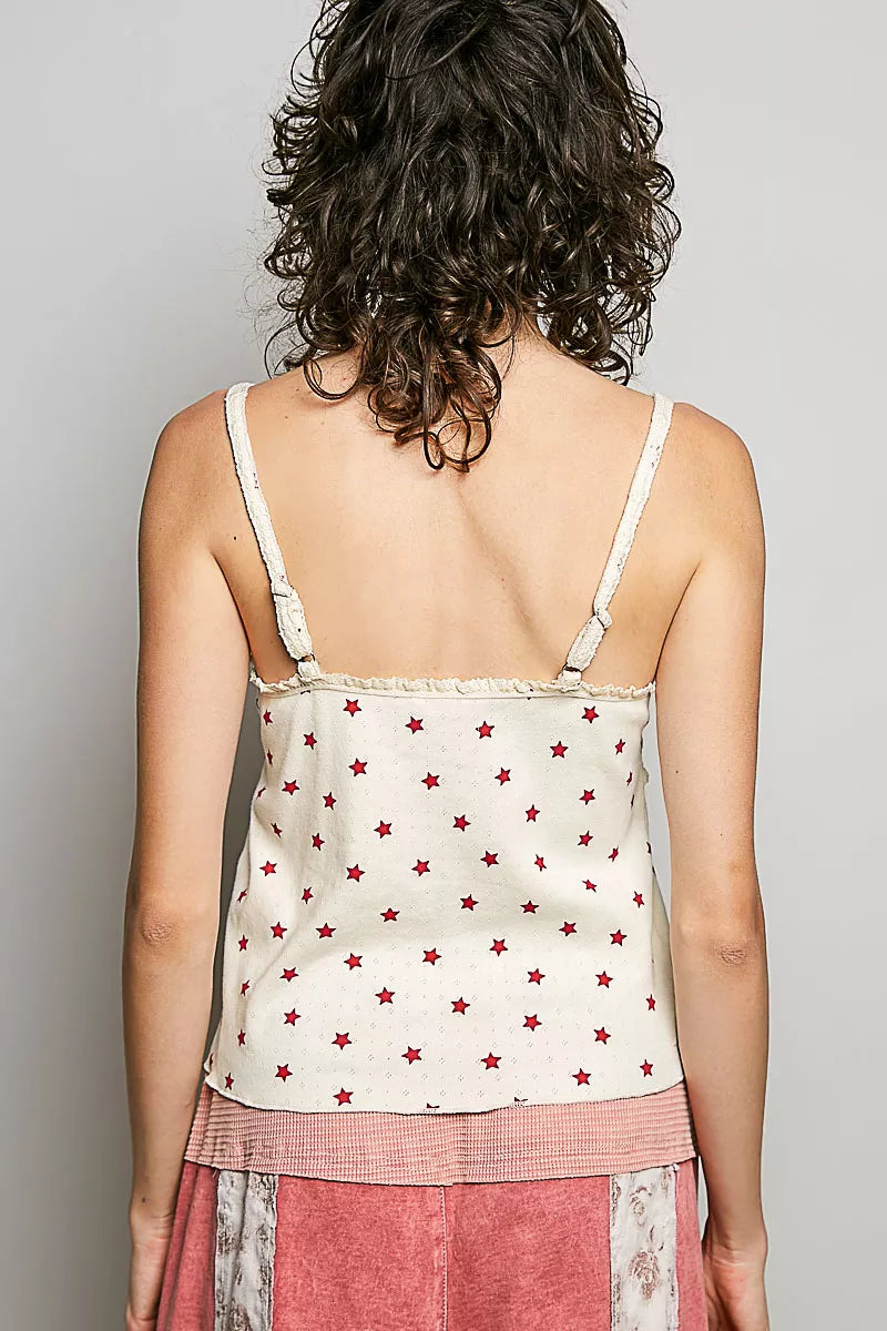 Back view: star-print ribbed knit cami, natural with red stars, thin spaghetti straps