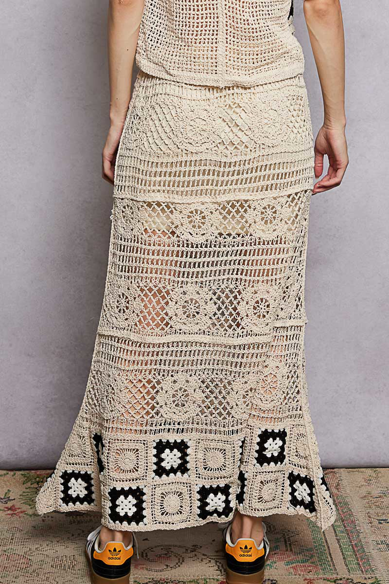 Natural crochet maxi skirt with ruffled waistband and black square trim at hem