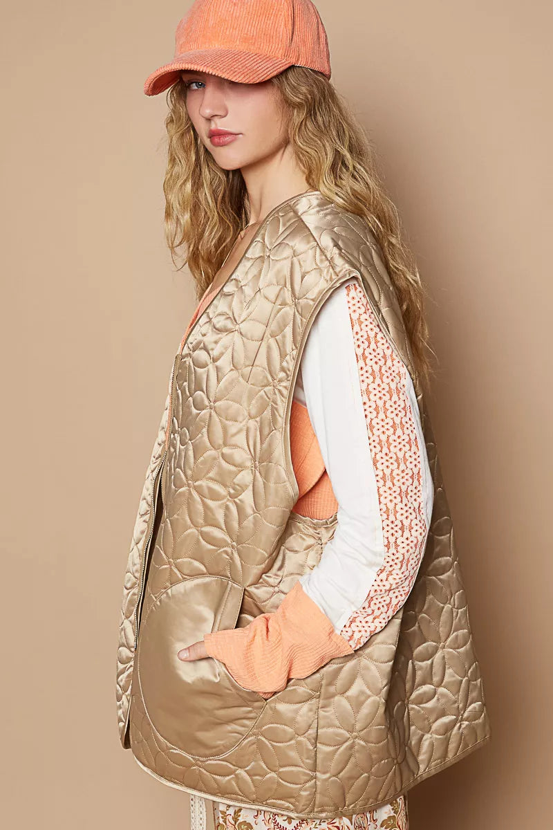 Quilted mocha front-zip vest with textured pattern and angled side pockets
