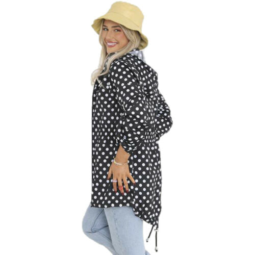 Black polka-dot hooded rain mac with adjustable drawstring hem