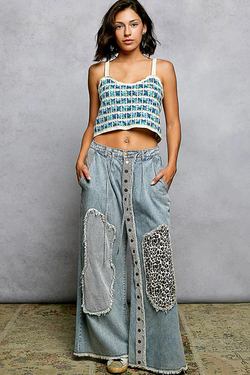 Blue crocheted cropped cami with scalloped hem and thin straps, front view