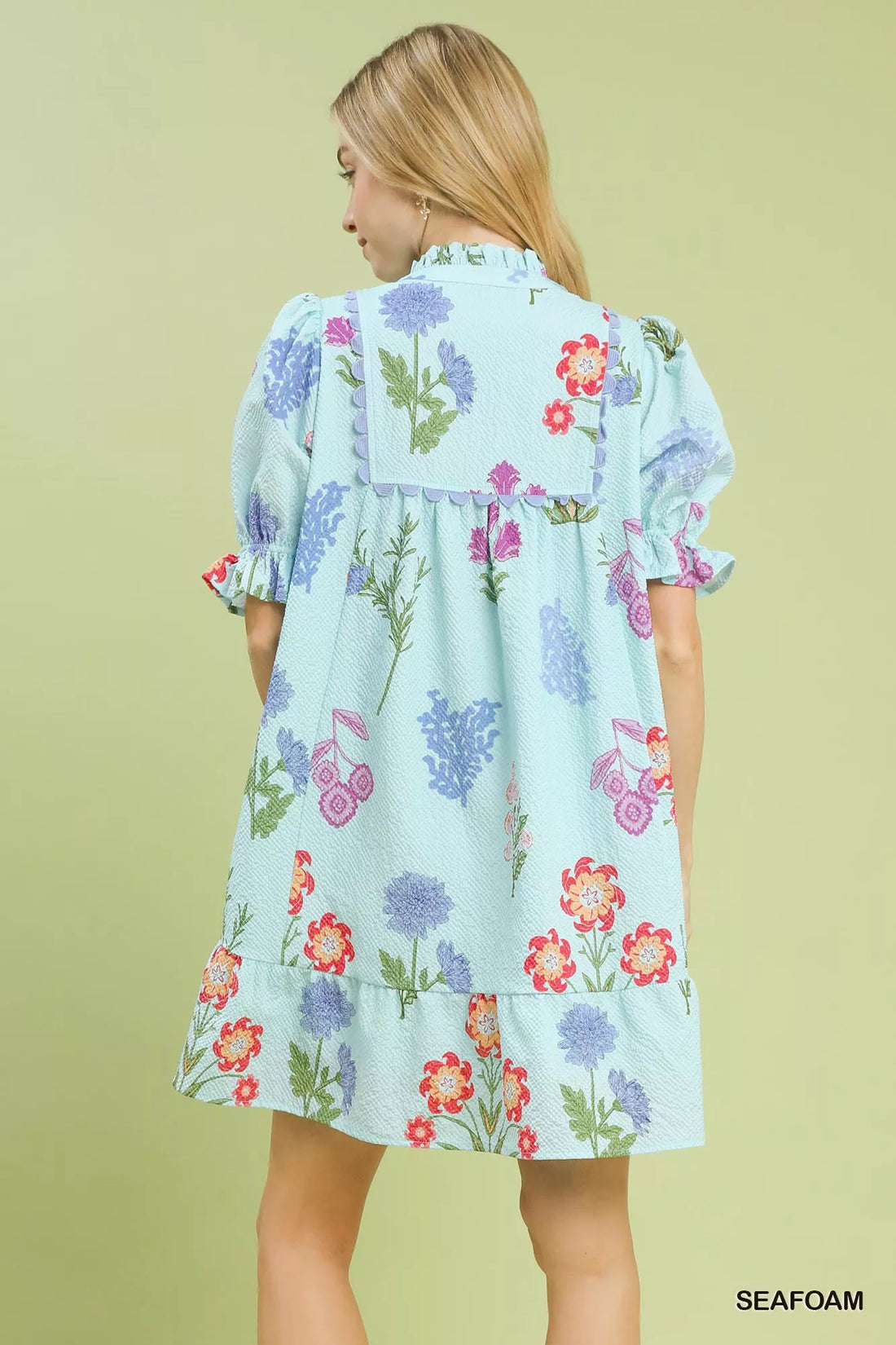 Seafoam floral print dress from back view with puff sleeves and yoke detailing