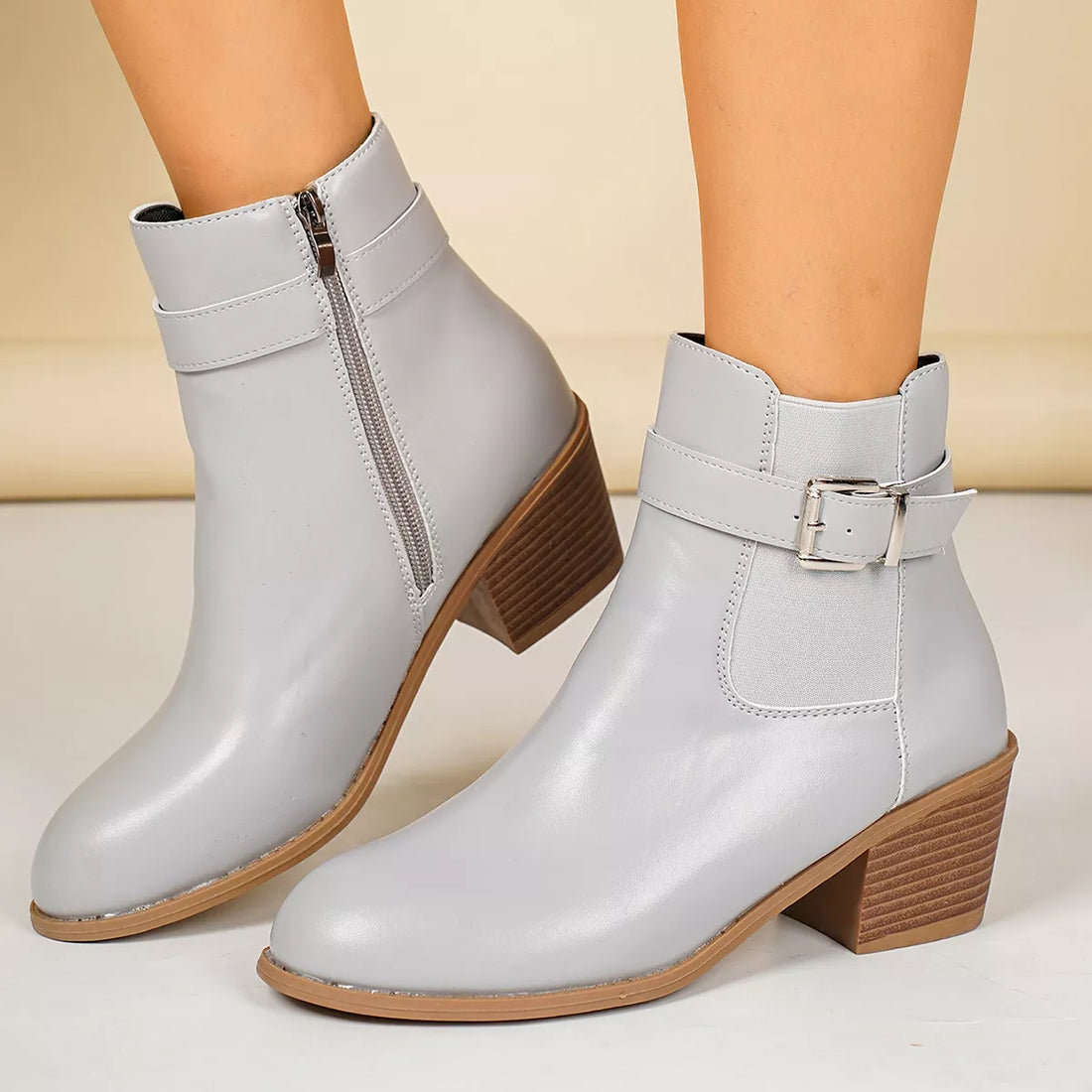 Gray point-toe block heel ankle boots with side zipper and buckle strap
