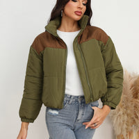 Women's puffer coat with army green body and brown contrast panels, zip front