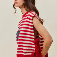 Red and ivory striped sleeveless vest top with navy star patch and tied side detail