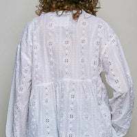 Off-white long-sleeve eyelet blouse with gathered back yoke and cutwork rows